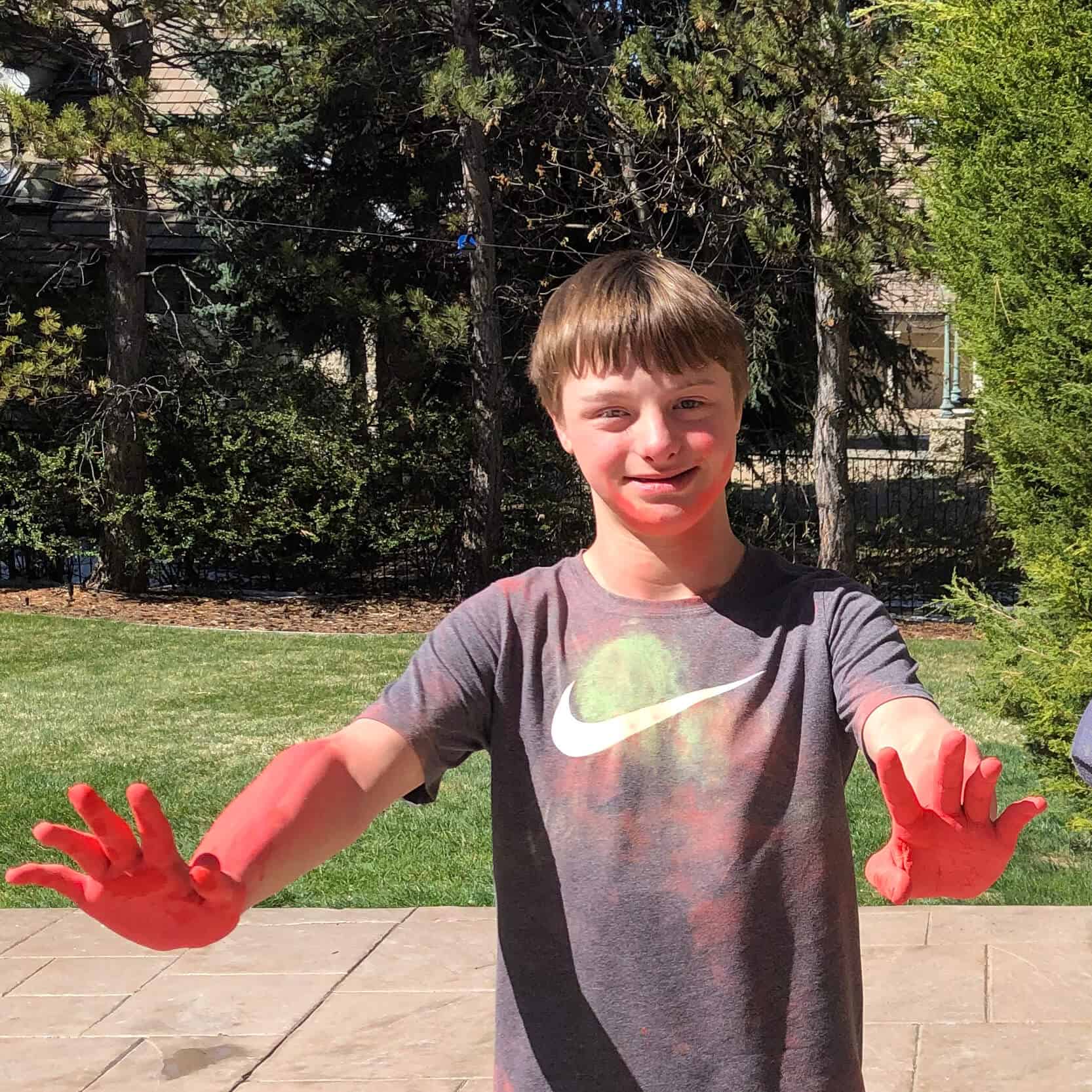 the real Guion (a young boy) with red chalk on his hands